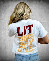 Back view of Loud, Intelligent & True women’s white crop tee with bold red and gold “LIT Since Day One” patriotic graphic print.