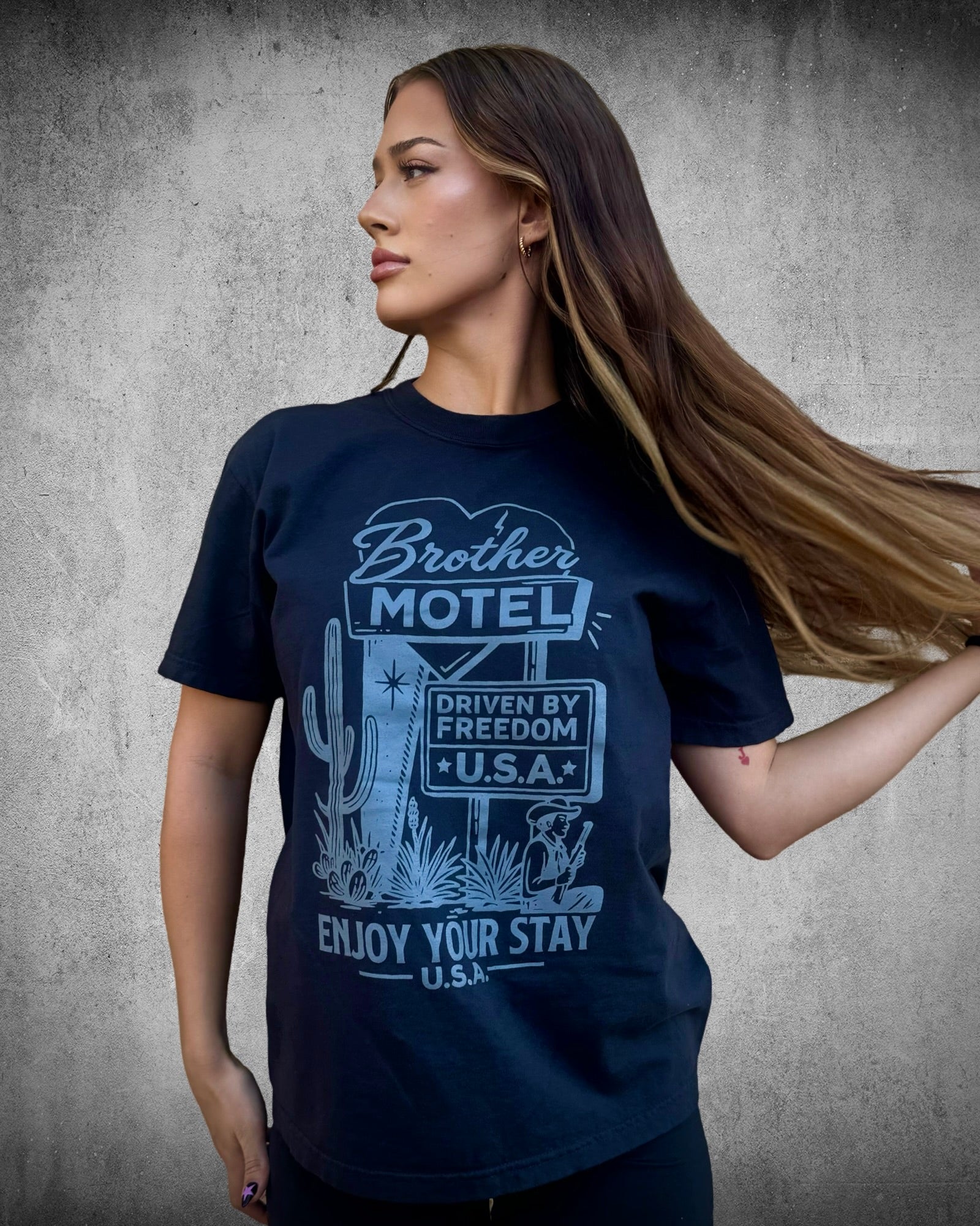 Side view of Brother Motel Tee — vintage Americana graphic t-shirt in black cotton, designed by Brother Apparel.