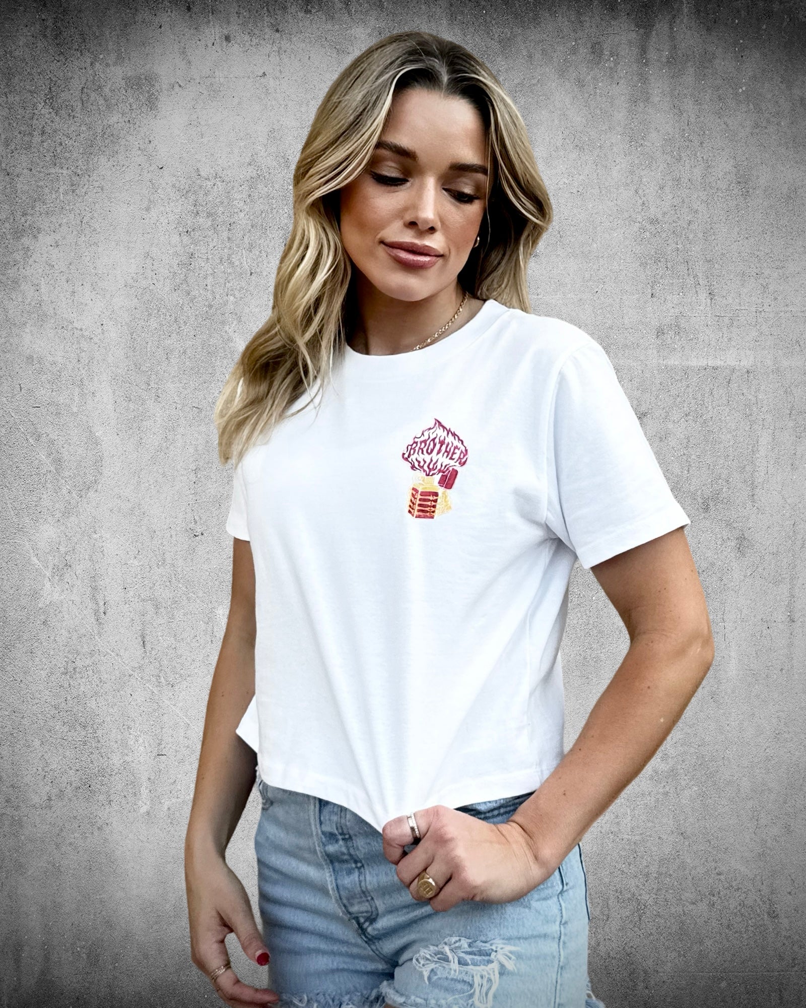 Loud, Intelligent & True women’s crop tee with Zippo lighter chest graphic featuring “Brother” in the flame.